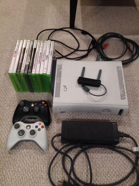 Xbox 360 with 2 controllers, games and wireless adapter