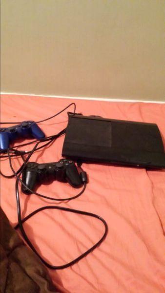Ps3 super slim with 2 controllers and about 10 games