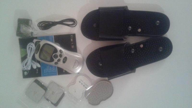 B.New tens machine with slippers and 3 pairs of pads . Dr Ho ect