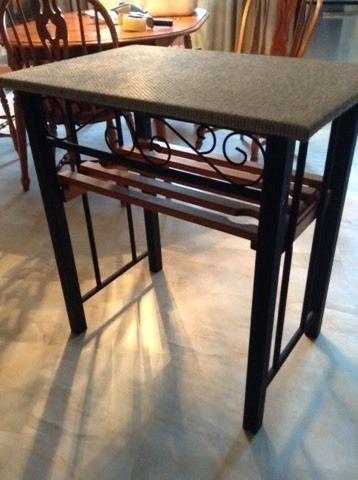 Black metal table with wood shelf & upholstered top