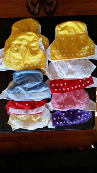 18 cloth diapers plus 3 wet bags