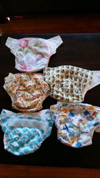 18 cloth diapers plus 3 wet bags