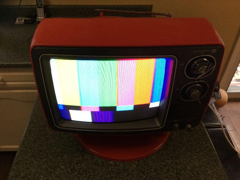 Vintage retro colour Toshiba TV television Orange with stand pop