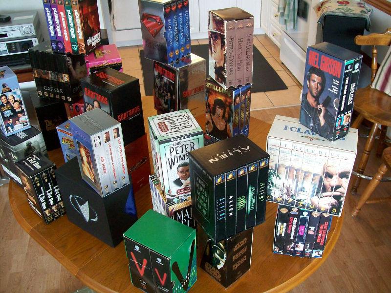 Collection of Box Set VHS Movies with Quality VCR Machine