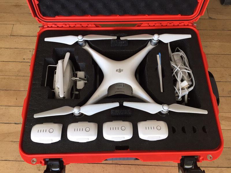 DJI Phantom 4 with case, triple charger, 4 batteries