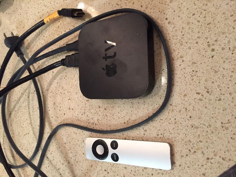 Apple TV with remote and cables
