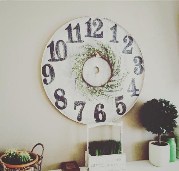 Large faux clock with berry wreath