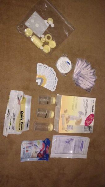 Medela Mini Electric breastpump + EXTRA bottles, valves, bags