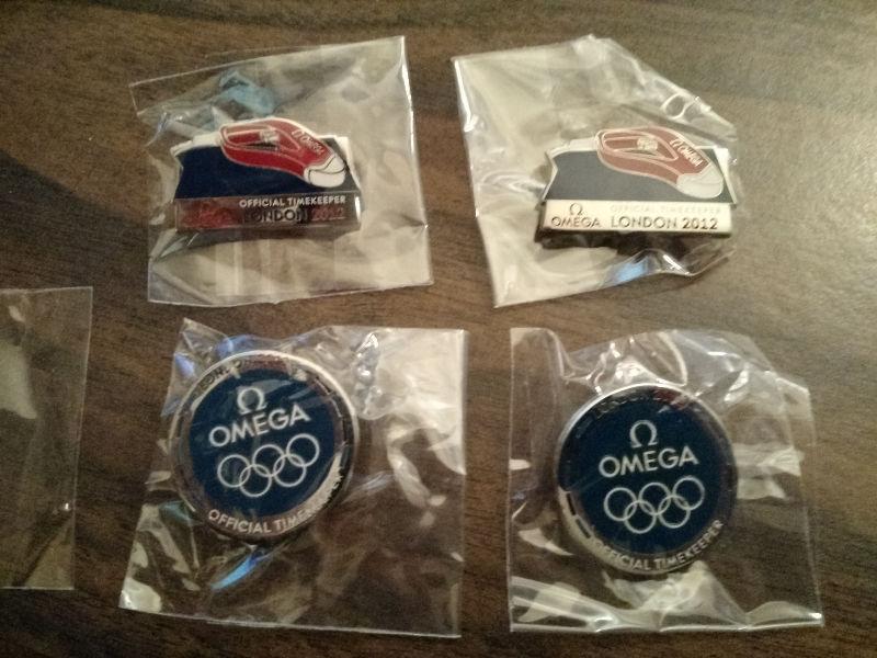 2012 London Olympic OMEGA pins -set of 7 pins new - $10